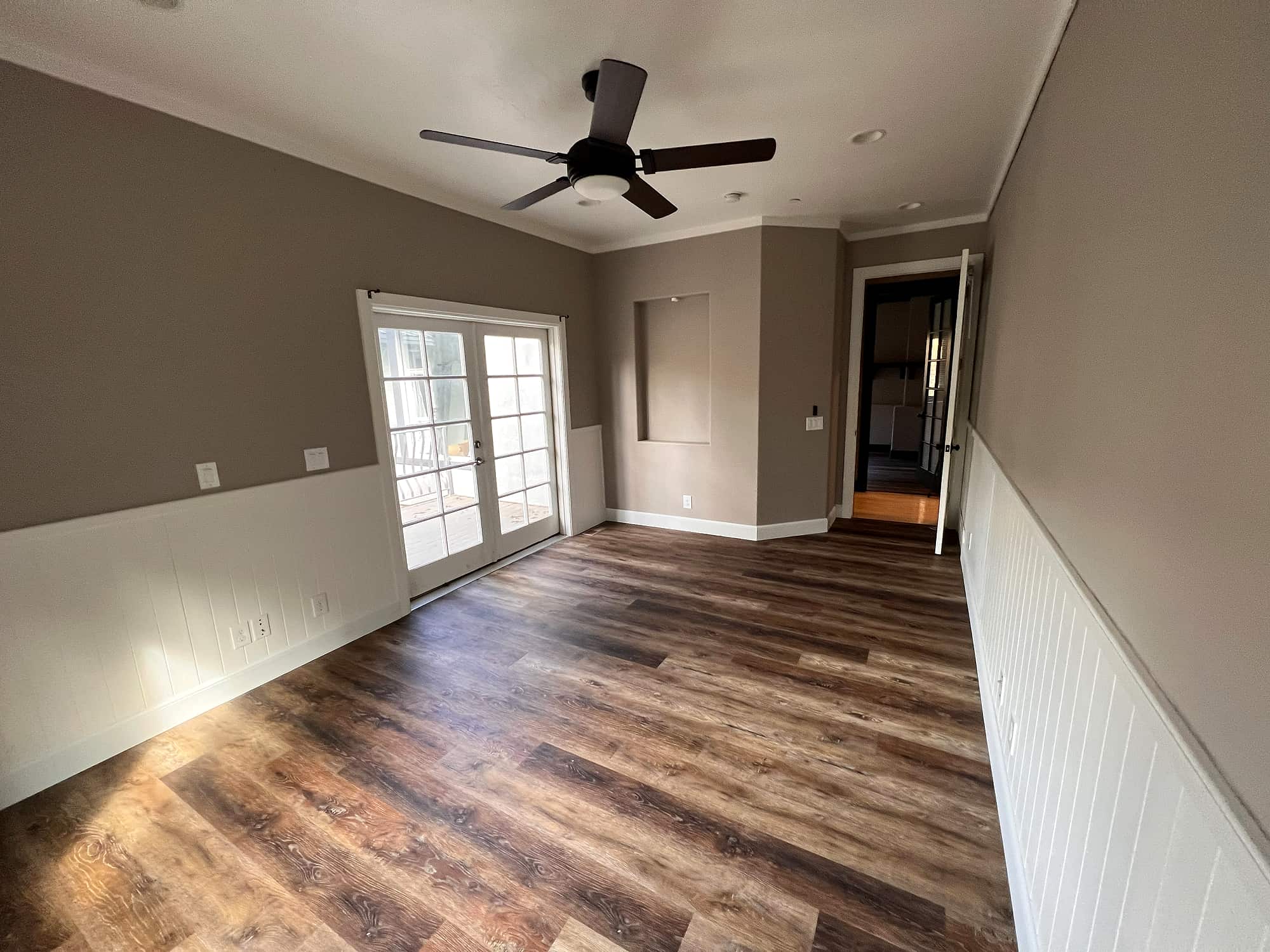 The same bedroom, toward its closets and the hall