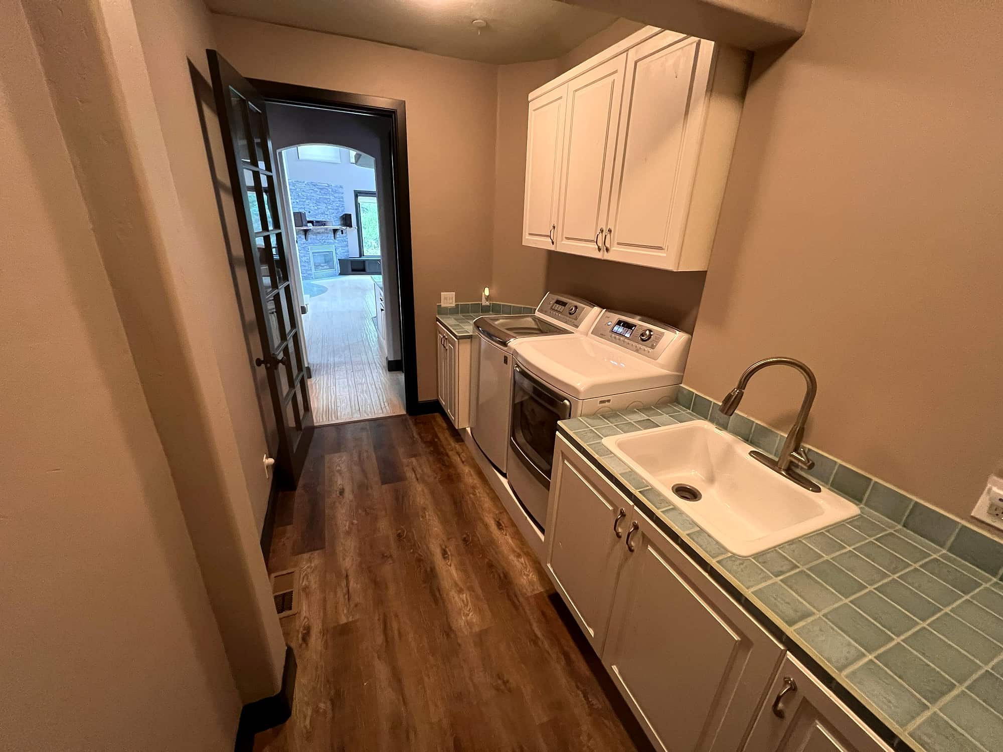 The laundry room, with a view through to the great room's fireplace